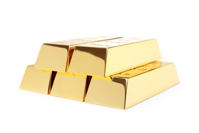 Photo of Precious shiny gold bars on white background