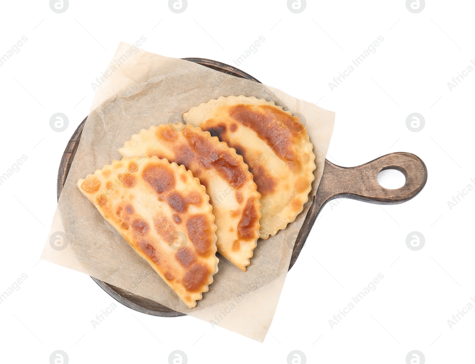 Photo of Wooden board with delicious fried chebureki isolated on white, top view