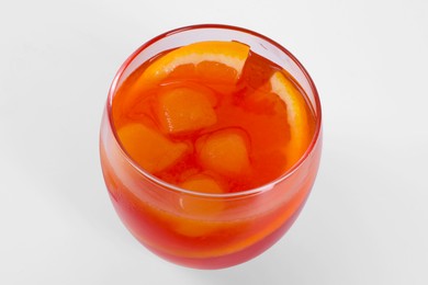 Photo of Aperol spritz cocktail and orange slices in glass isolated on white