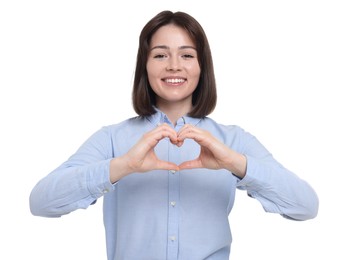 Happy woman showing heart gesture with hands on white background