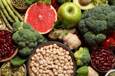 Photo of Fresh vegetables, fruits and seeds on table, flat lay