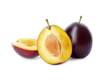 Photo of Whole and cut ripe plums on white background