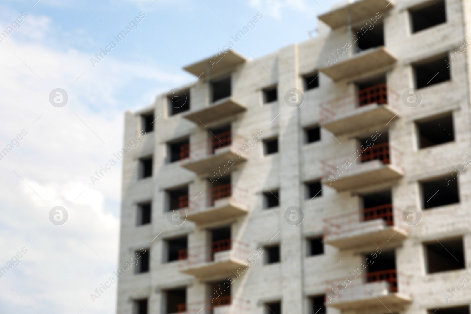 Photo of Blurred view of unfinished white building outdoors