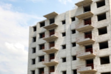 Blurred view of unfinished white building outdoors