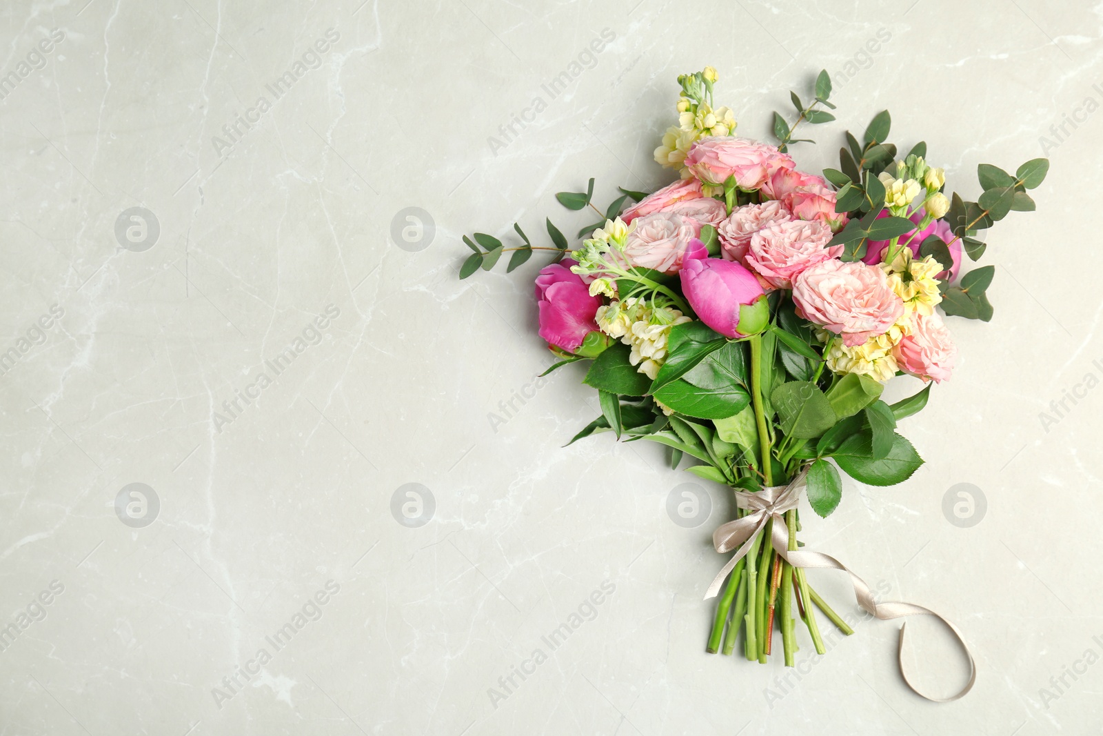 Photo of Bouquet of beautiful fragrant flowers on table