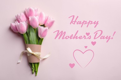 Image of Happy Mother's Day. Bouquet of beautiful tulips on pink background, top view