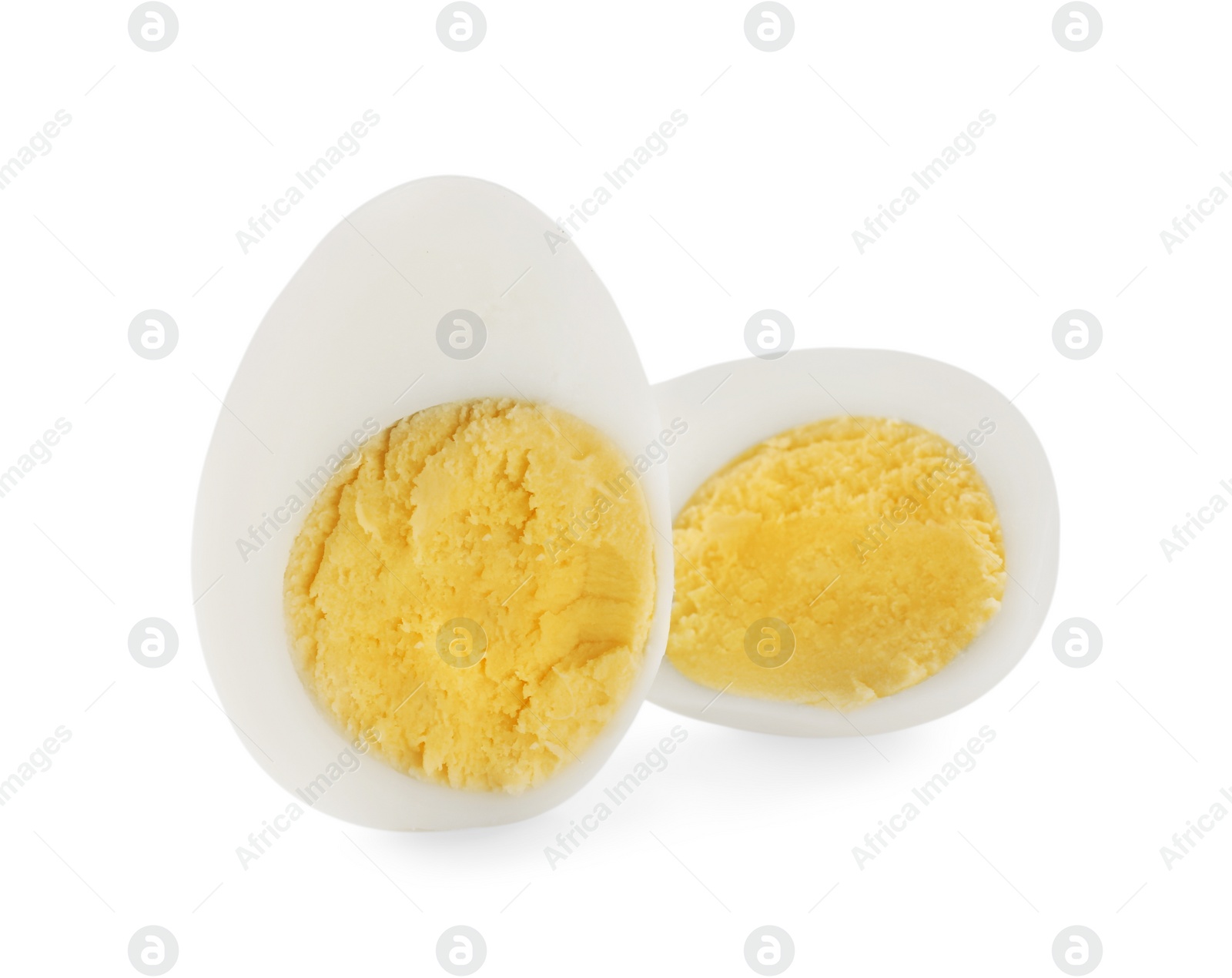 Photo of Halves of peeled hard boiled quail egg on white background