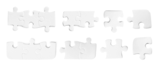 Set with jigsaw puzzle pieces on white background, top view. Banner design 