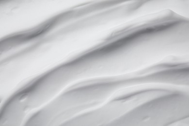 Photo of Texture of white shaving foam as background, top view