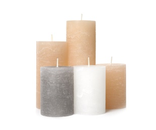 Photo of Many color wax candles on white background