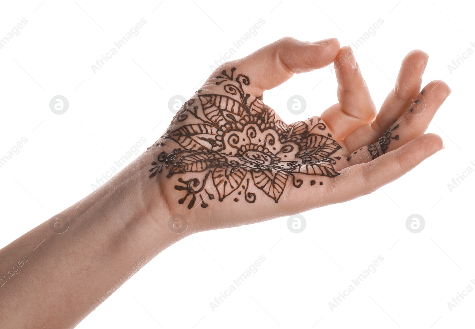 Photo of Woman with henna tattoo on palm against white background, closeup. Traditional mehndi ornament