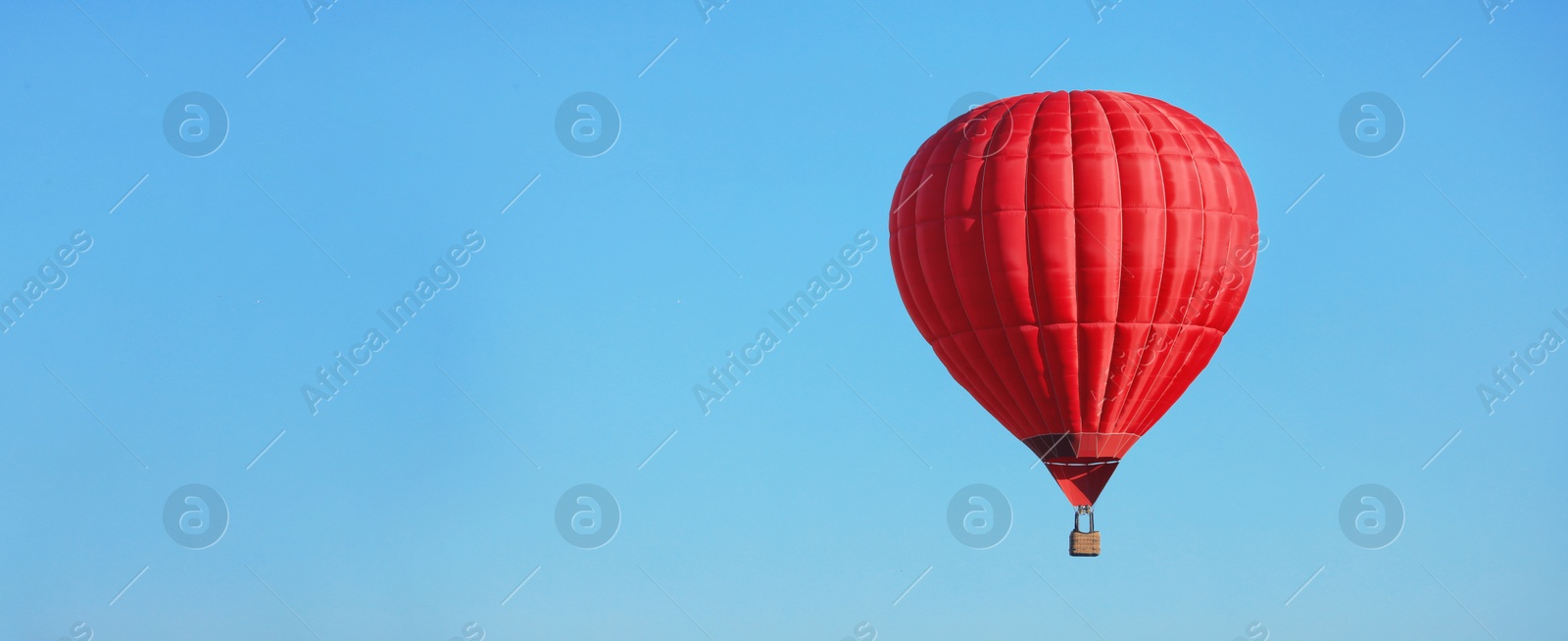 Image of Hot air balloon in blue sky, space for text. Banner design 