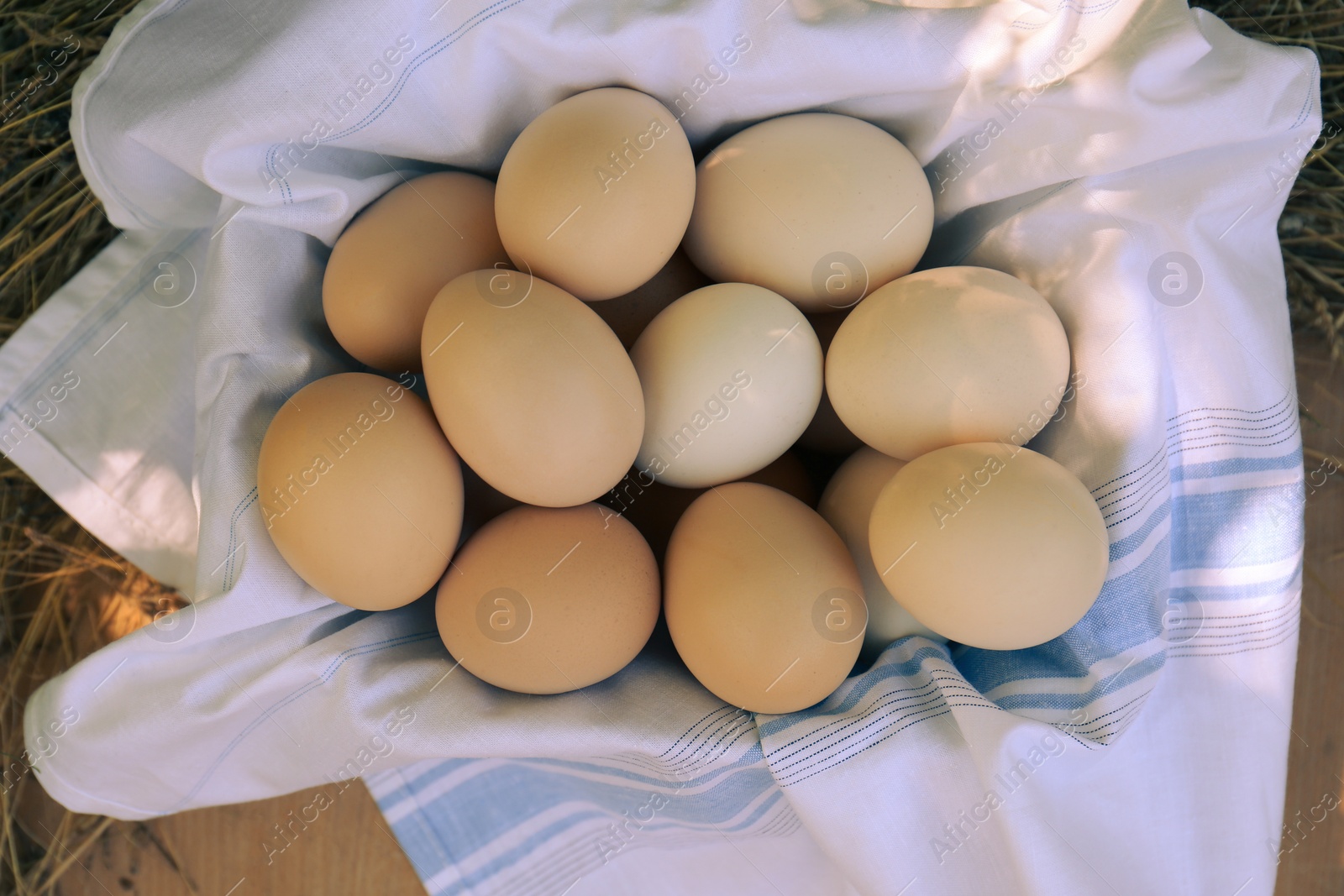 Photo of Fresh raw eggs on table, top view