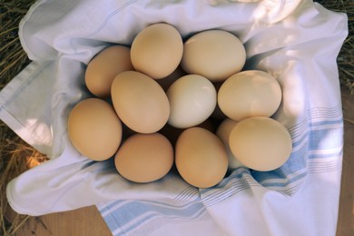 Photo of Fresh raw eggs on table, top view