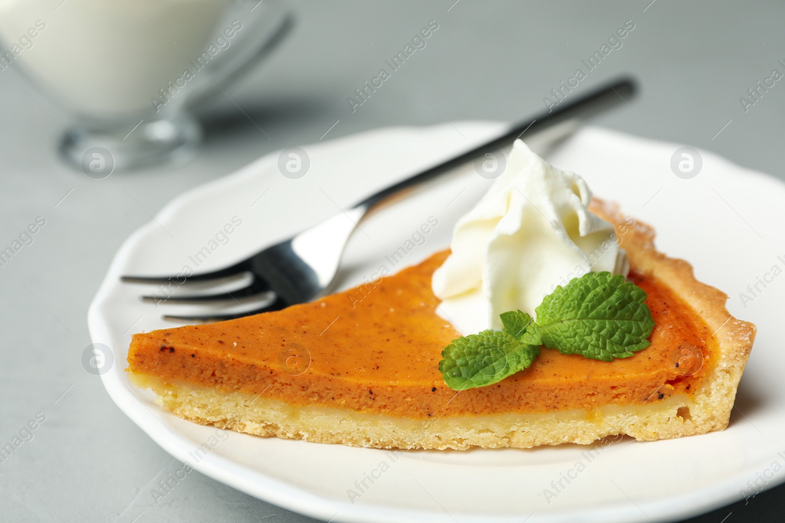 Image of Piece of fresh homemade pumpkin pie on table