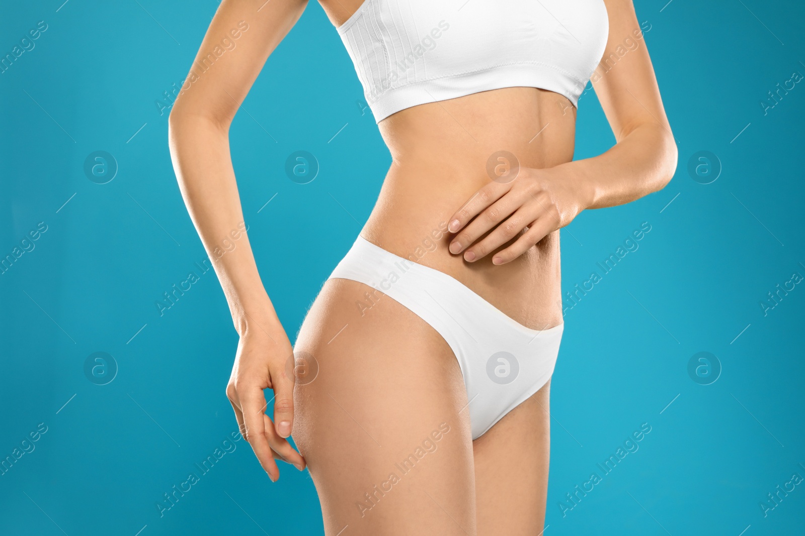 Photo of Slim young woman with smooth skin on color background, closeup. Beauty and body care concept