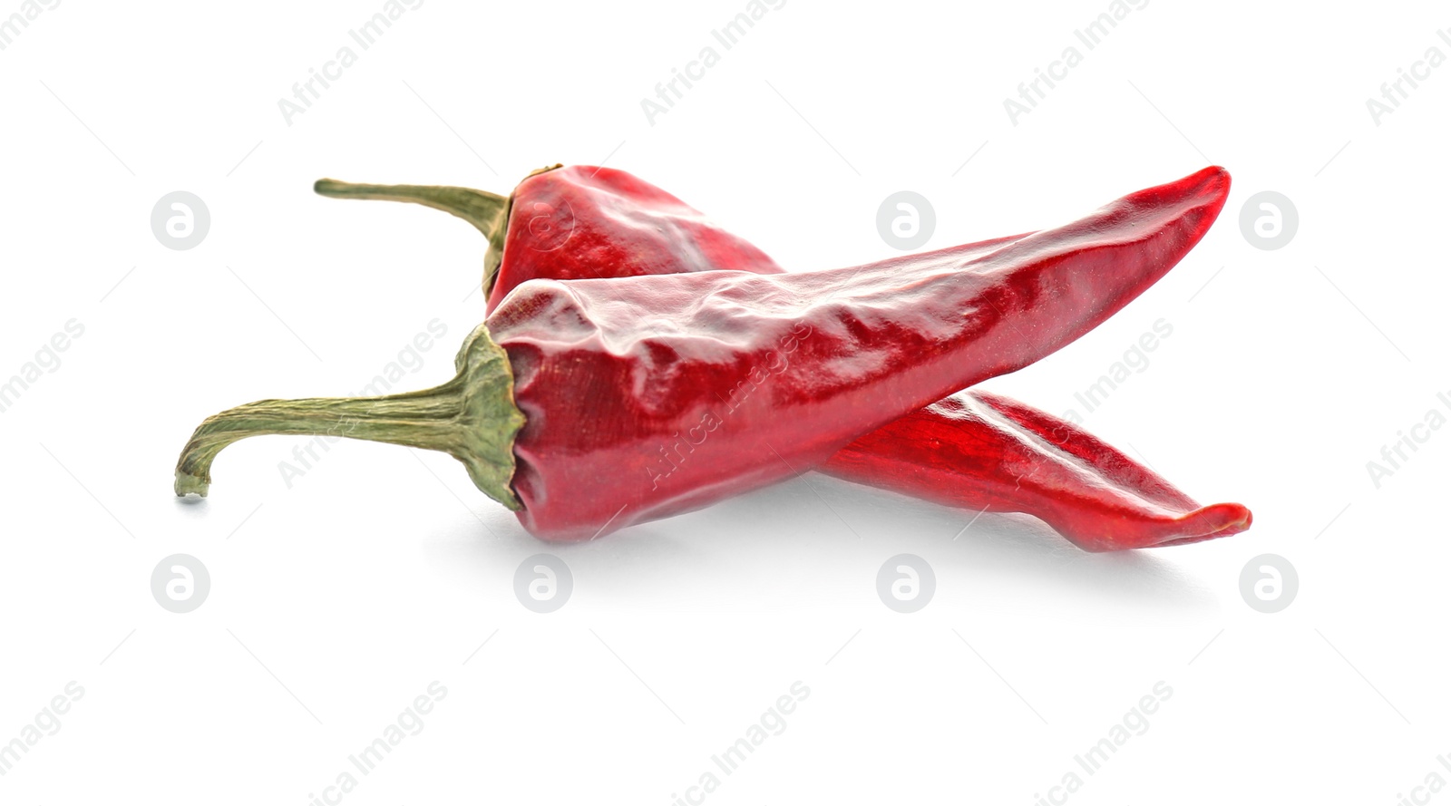 Photo of Dry chili peppers on white background