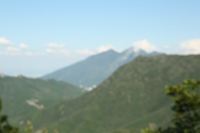 Photo of Big mountains under cloudy sky, blurred view