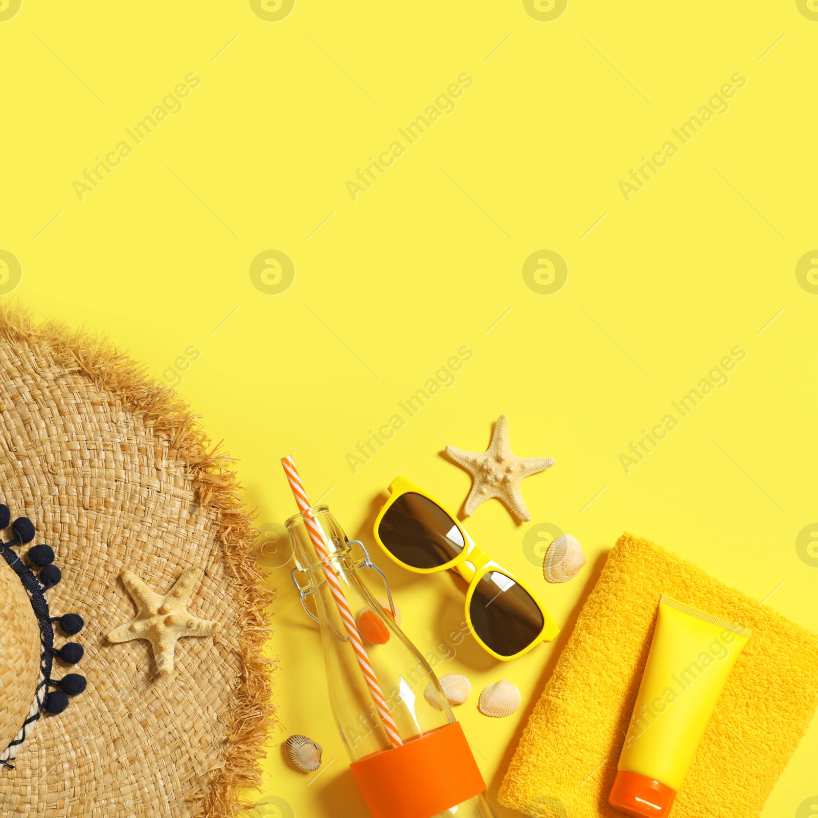 Photo of Flat lay composition with beach accessories on color background. Space for text