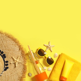 Photo of Flat lay composition with beach accessories on color background. Space for text