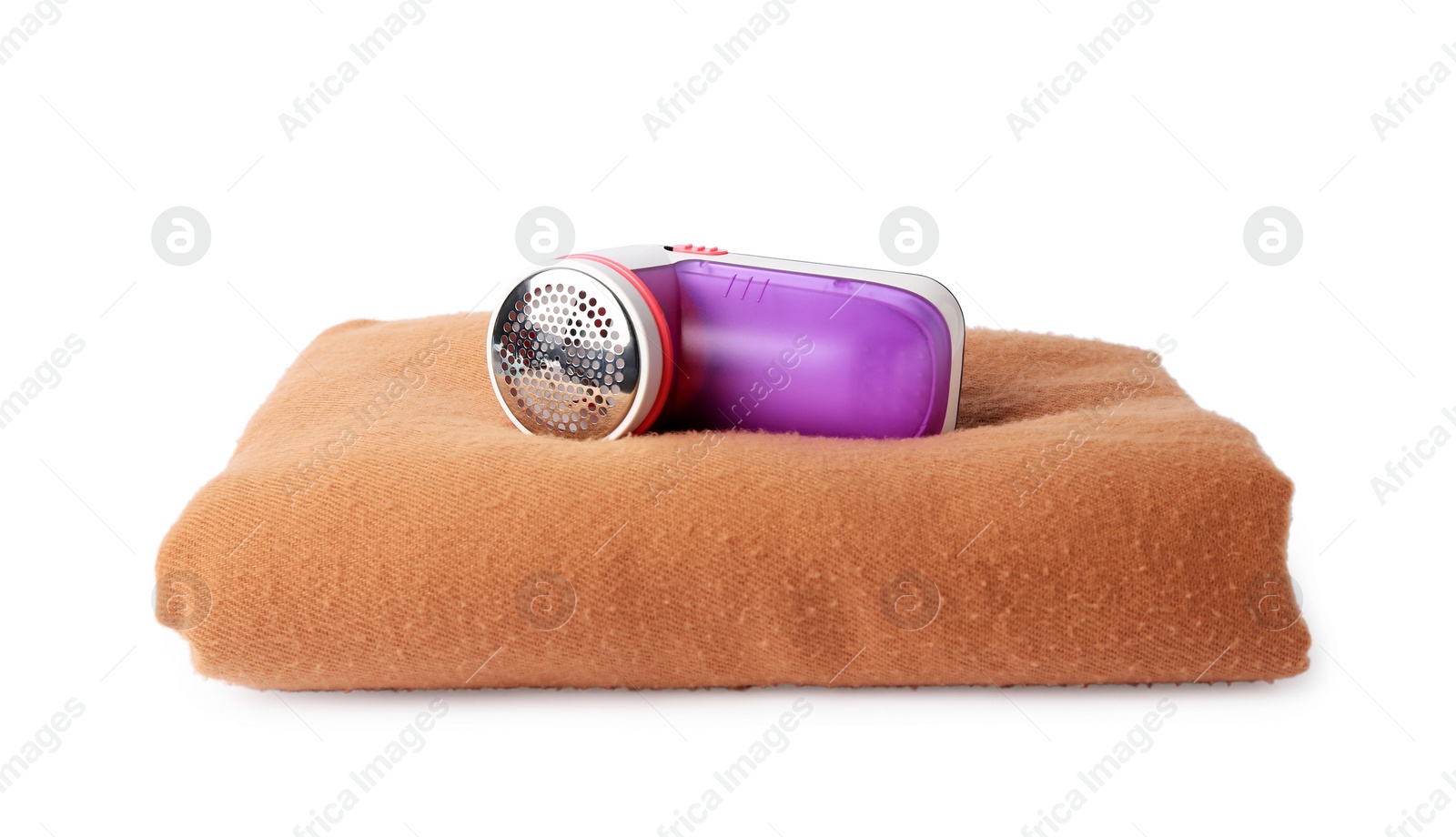 Photo of Fabric shaver and woolen cloth with lint on white background