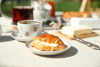 Photo of Beautiful table setting in garden on sunny day, closeup