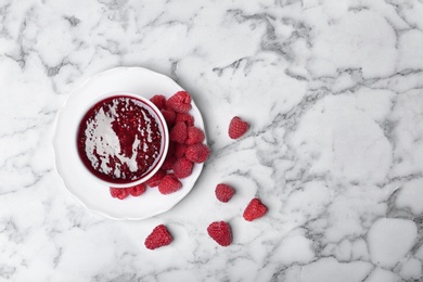 Photo of Flat lay composition with delicious raspberry jam on marble background