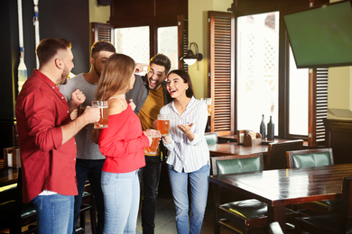 Group of football fans in sport bar