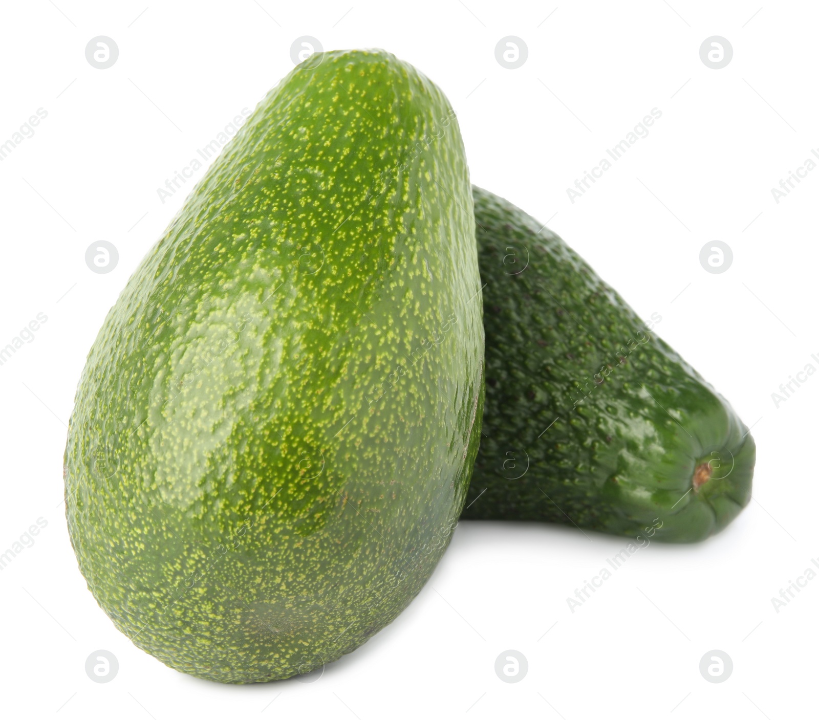 Photo of Tasty ripe avocados on white background. Tropical fruit