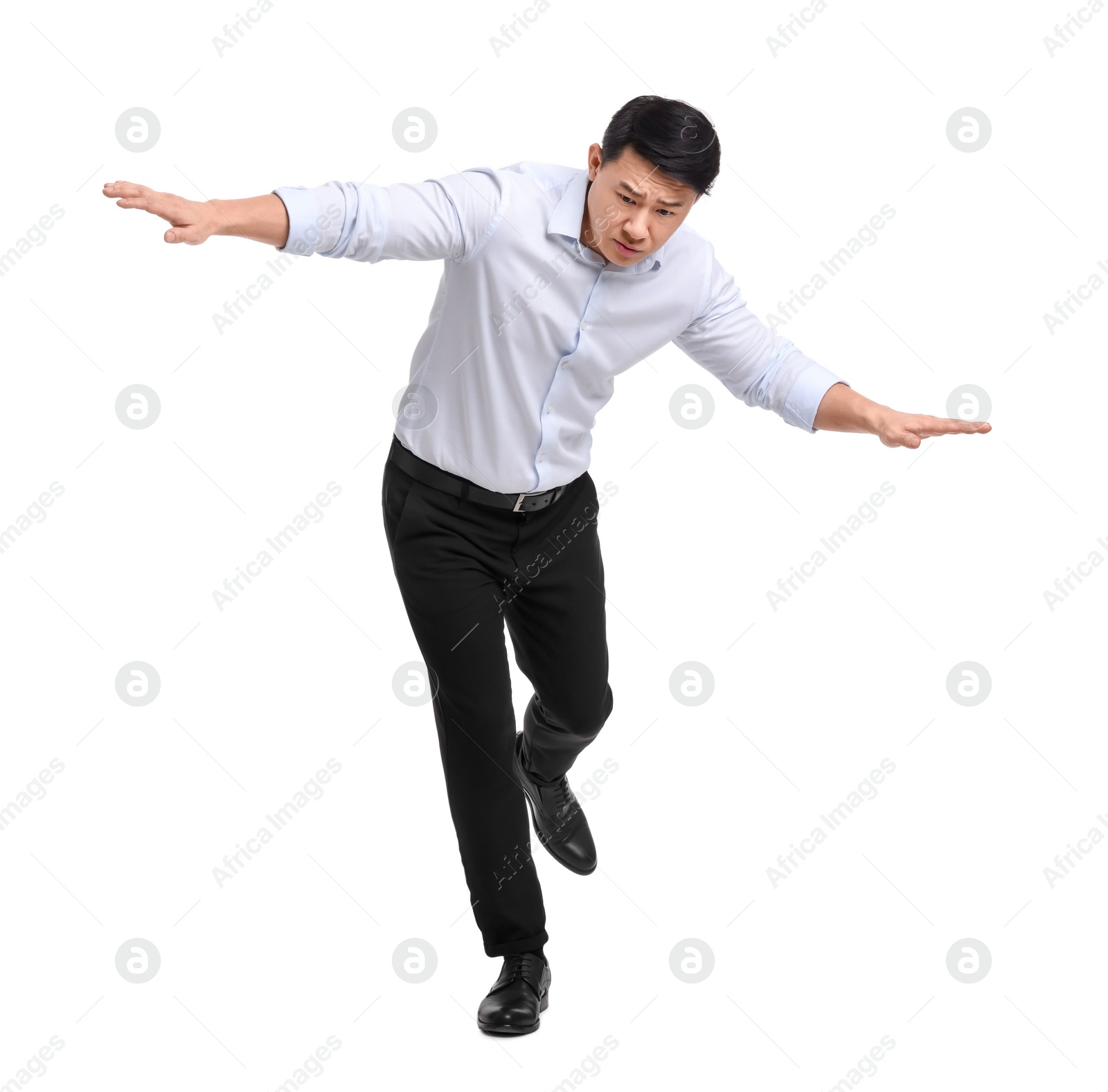 Photo of Businessman in formal clothes posing on white background