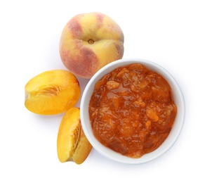 Bowl with peach jam and fresh fruit on white background, top view