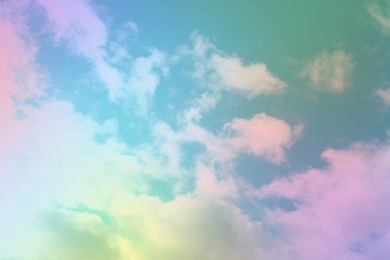 Image of Fantasy world. Picturesque view of beautiful magic sky with fluffy clouds, toned in pastel rainbow or unicorn colors