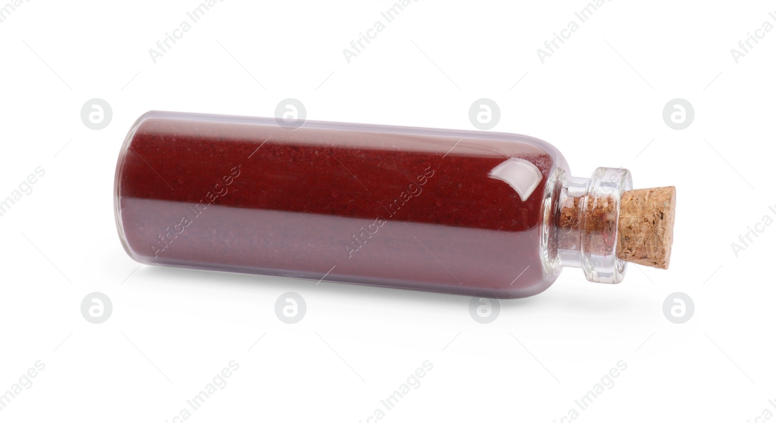 Photo of Glass bottle of burgundy food coloring isolated on white