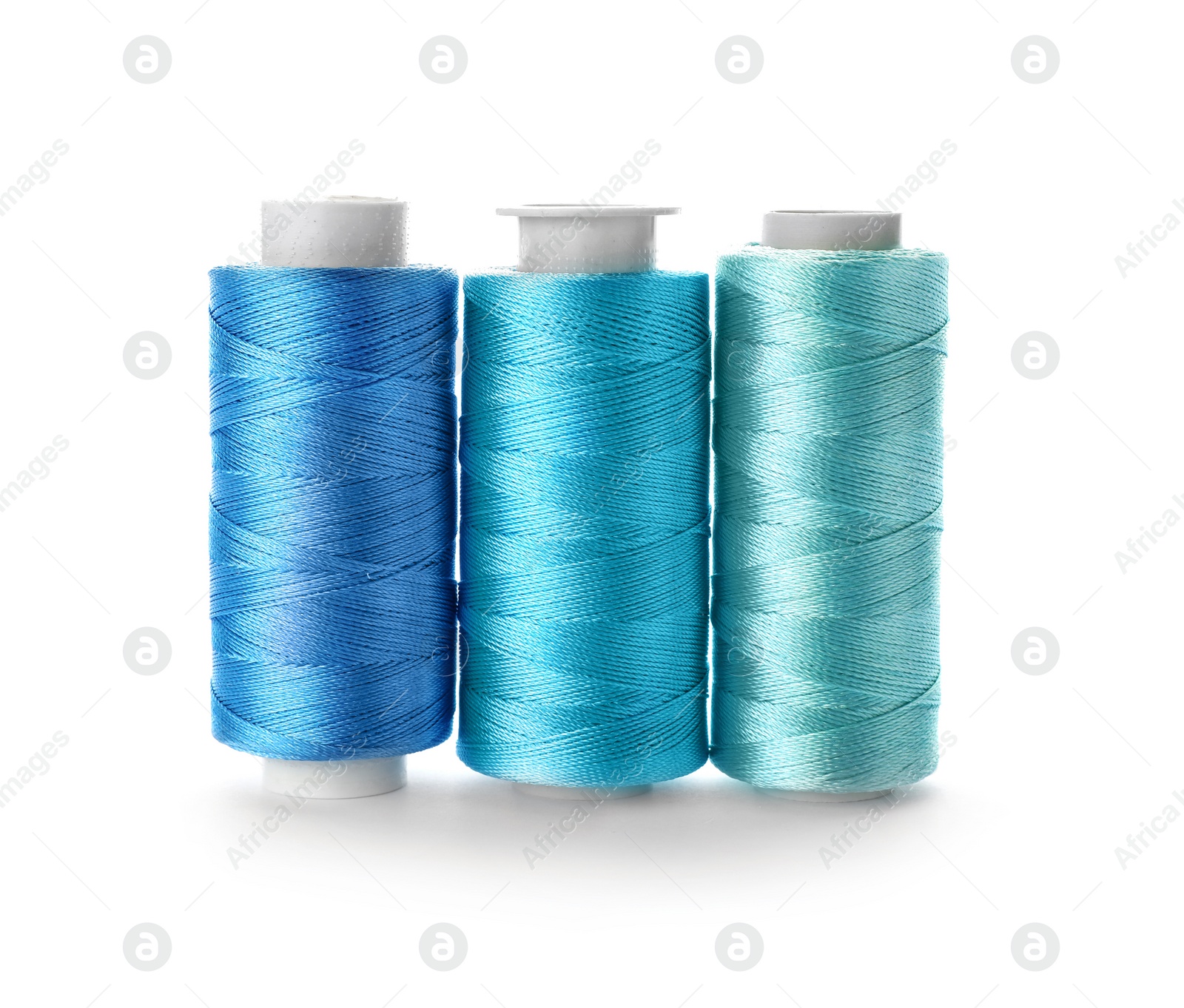 Photo of Color sewing threads on white background