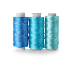 Photo of Color sewing threads on white background