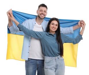 Photo of Happy couple with flag of Ukraine on white background