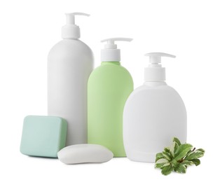 Soap bars and bottle dispensers on white background