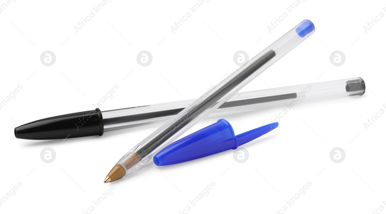Photo of New black and blue pens isolated on white