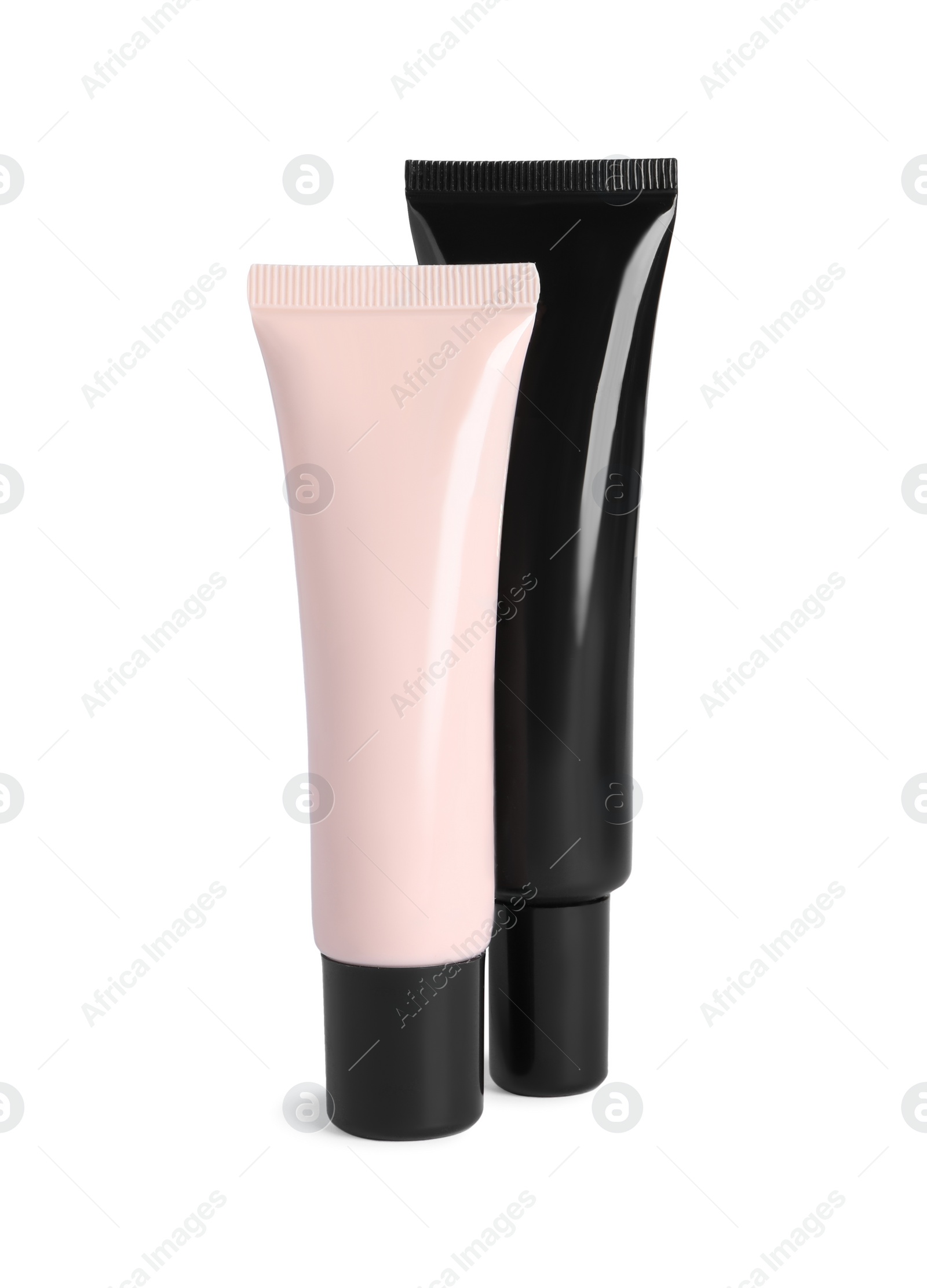 Photo of Tubes of skin foundation on white background. Makeup product