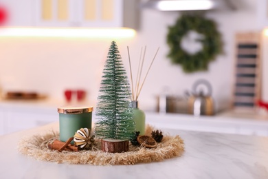 Photo of Composition with decorative Christmas tree on light table in kitchen