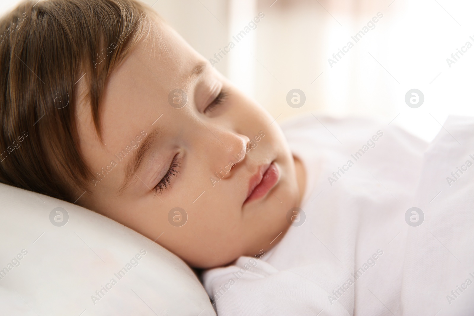 Photo of Cute little baby peacefully sleeping at home. Bedtime