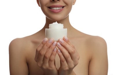 Photo of Woman holding jar of facial cream on white background, closeup