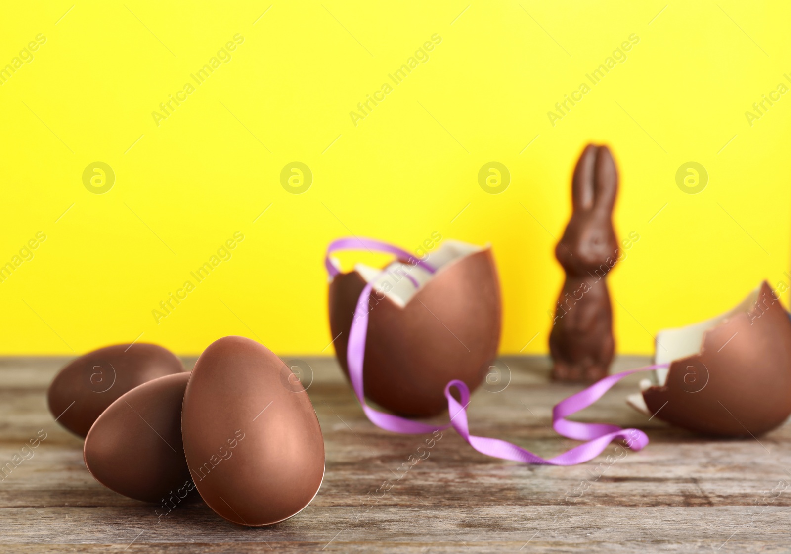 Photo of Beautiful composition with chocolate Easter eggs on wooden table