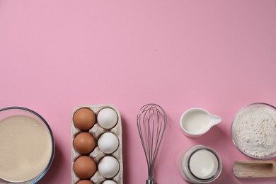 Photo of Flat lay composition with whisk and dough in bowl on pink background. Space for text