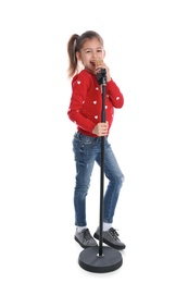 Photo of Cute funny girl with microphone on white background