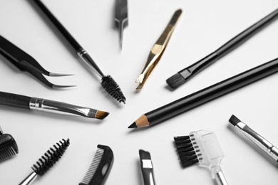 Photo of Set of professional eyebrow tools on white background