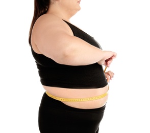 Overweight woman with measuring tape on white background, closeup