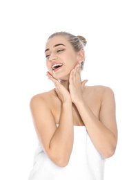 Portrait of young pretty woman with towel on white background