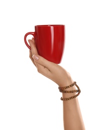 Photo of Woman holding elegant red cup on white background, closeup