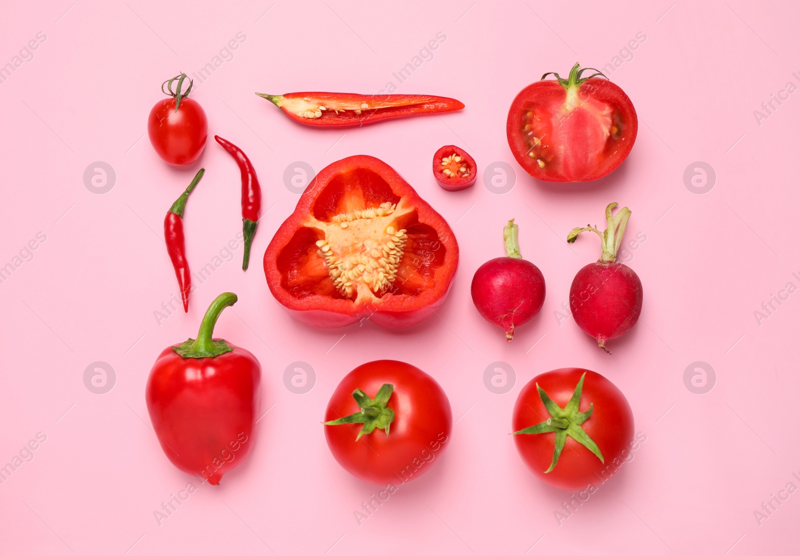 Photo of Flat lay composition with fresh vegetables on pink background